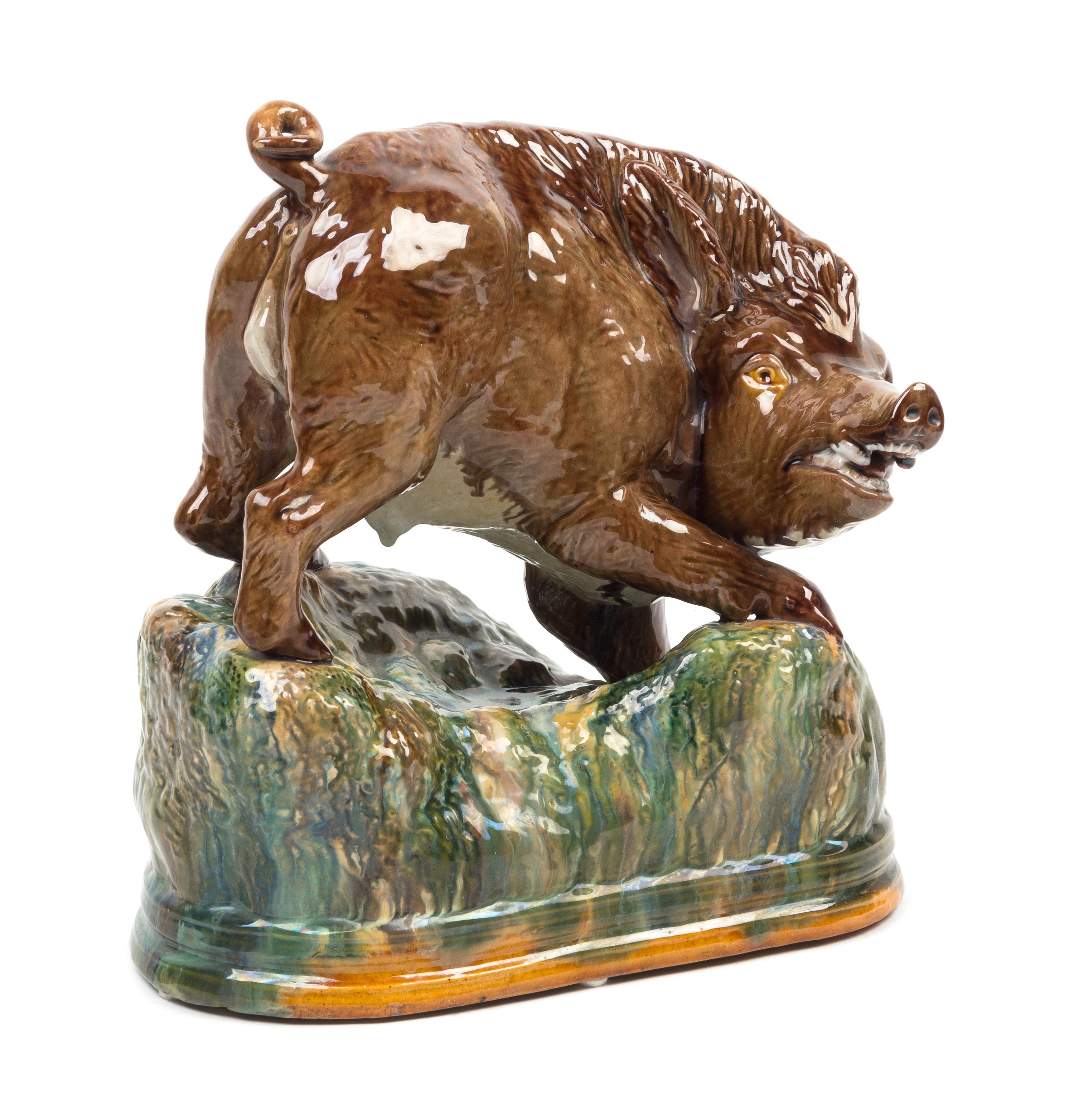 A Portuguese Majolica Figure of a Wild Boar Height 10 1/2 x width 10 inches. — 19TH CENTURY