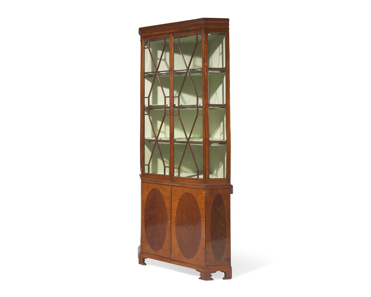 A fine George III inlaid mahogany and satinwood corner cupboard, circa 1790