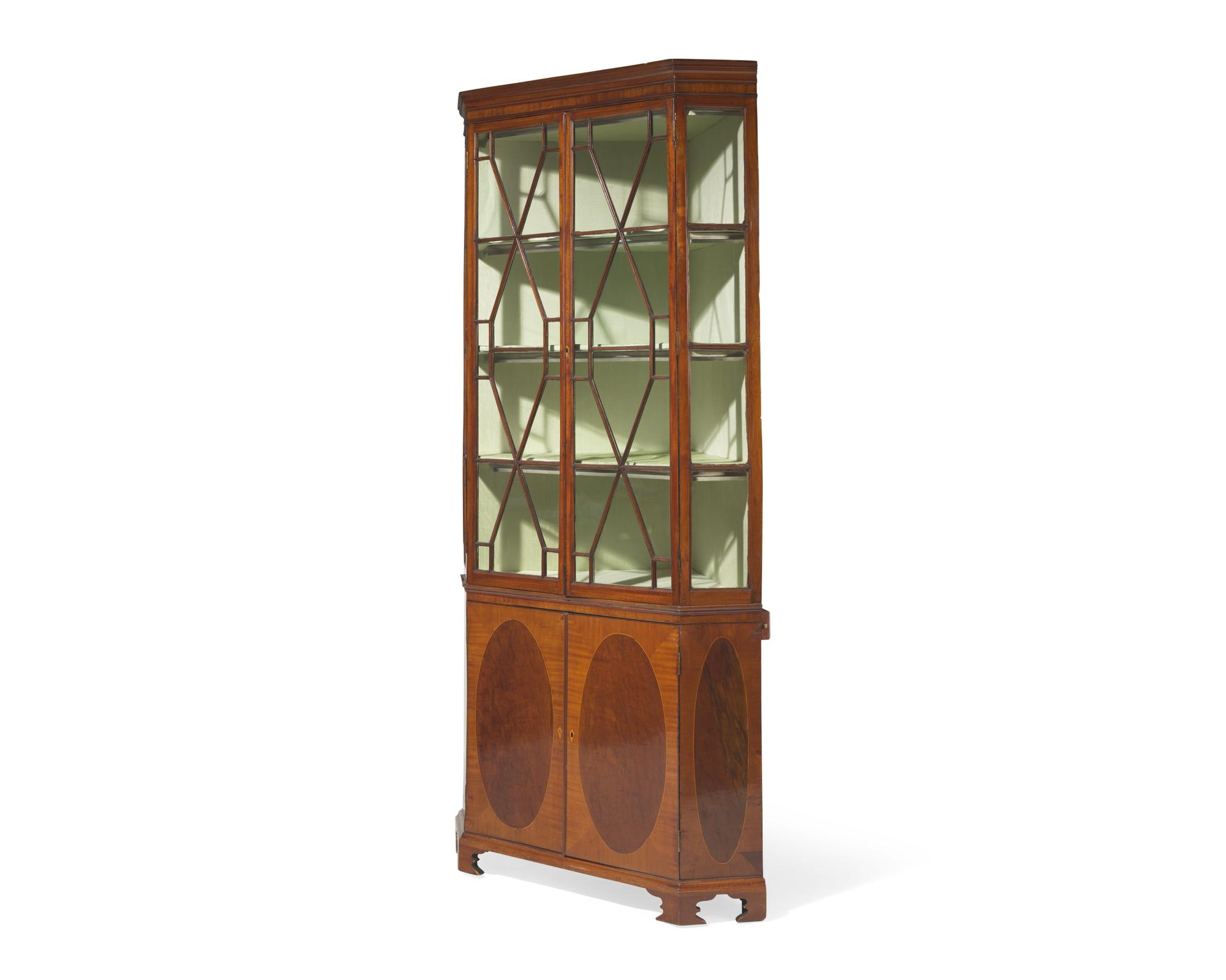 A fine George III inlaid mahogany and satinwood corner cupboard, circa 1790