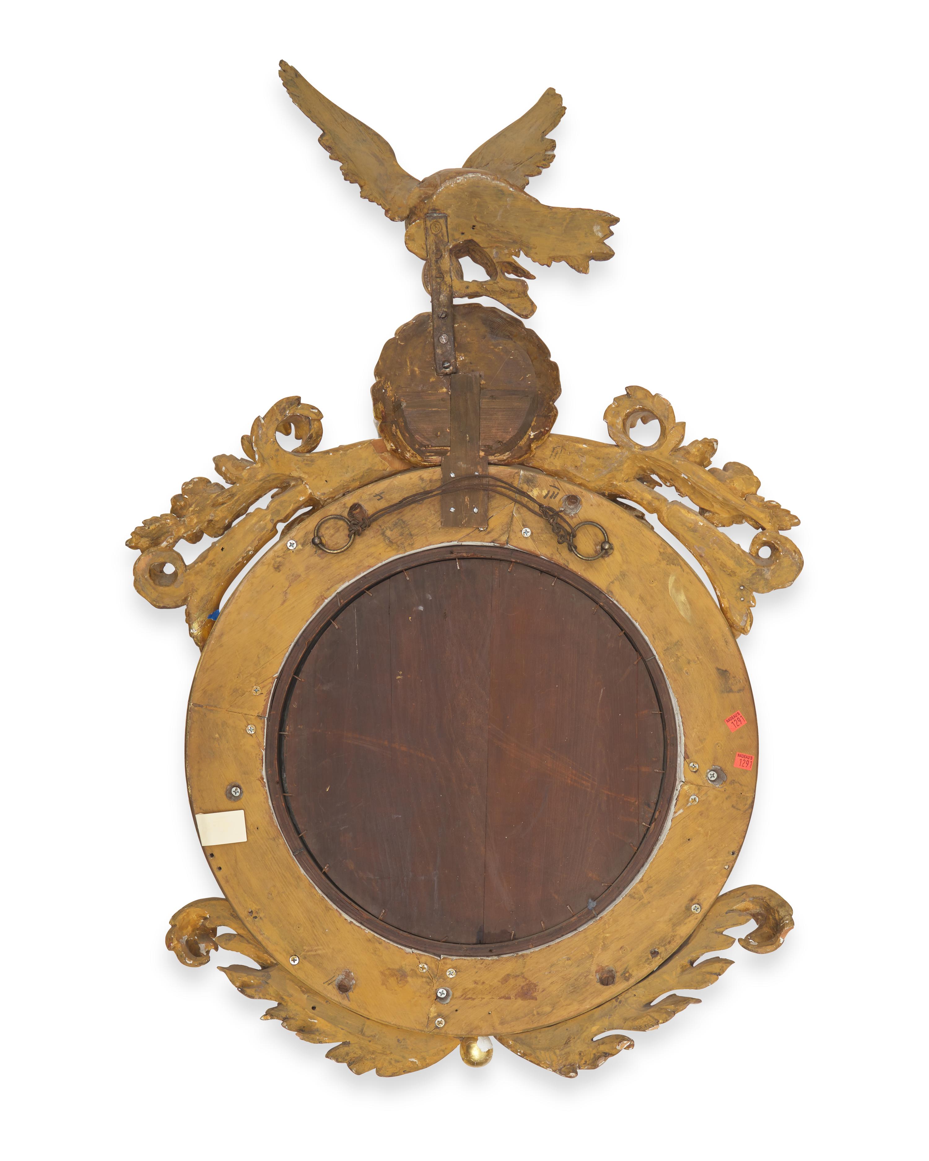A Classical Carved and Giltwood Bull's Eye Mirror
