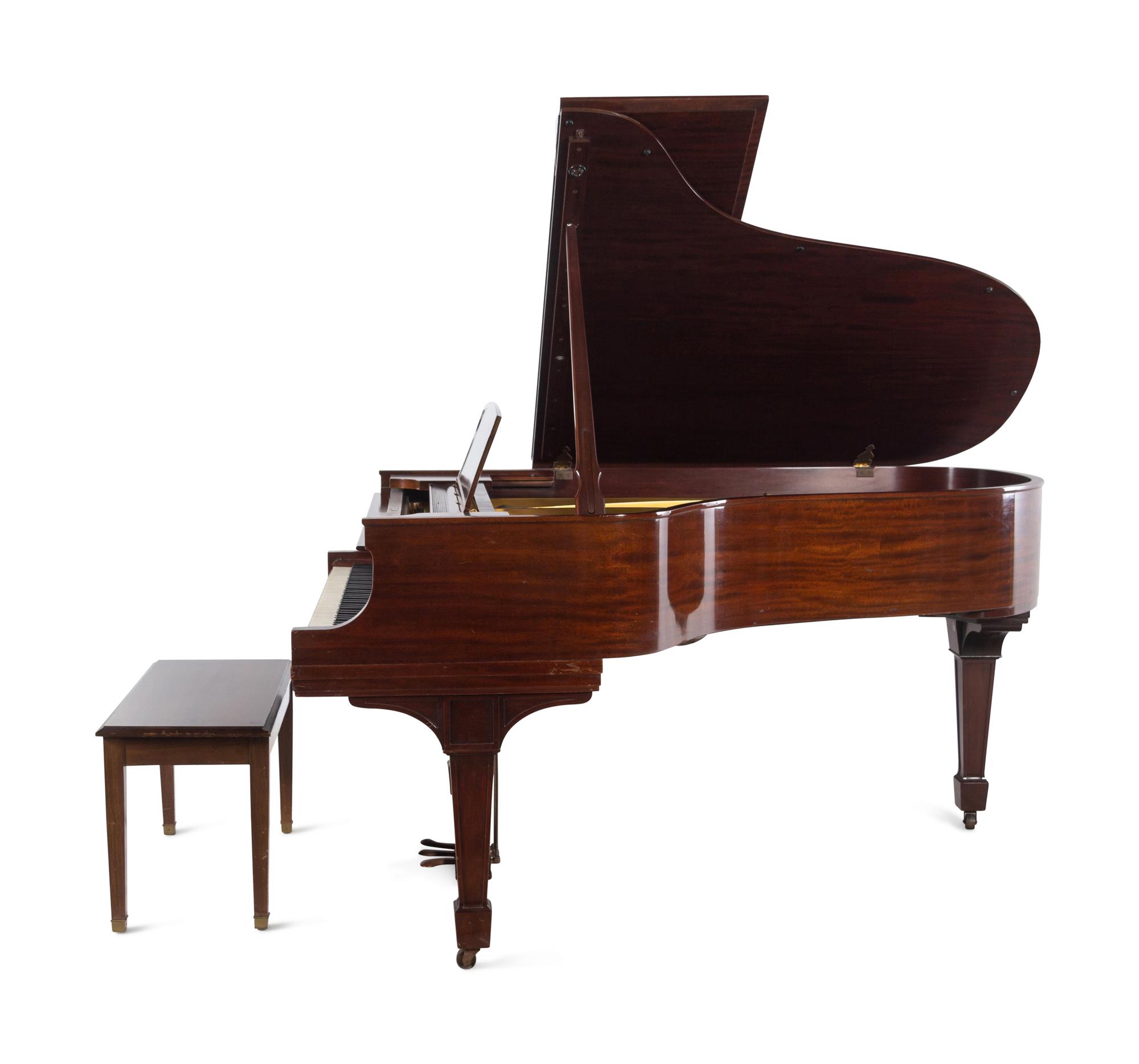 A Steinway and Sons Walnut Grand Piano and Bench