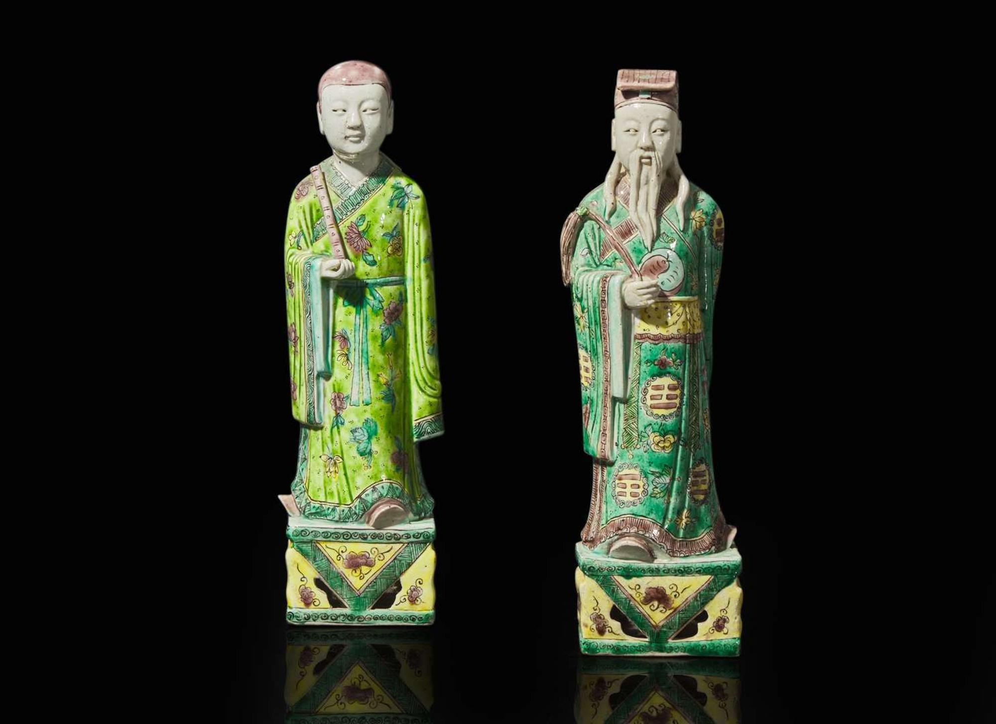 A pair of Chinese famille verte-decorated porcelain Daoist immortals