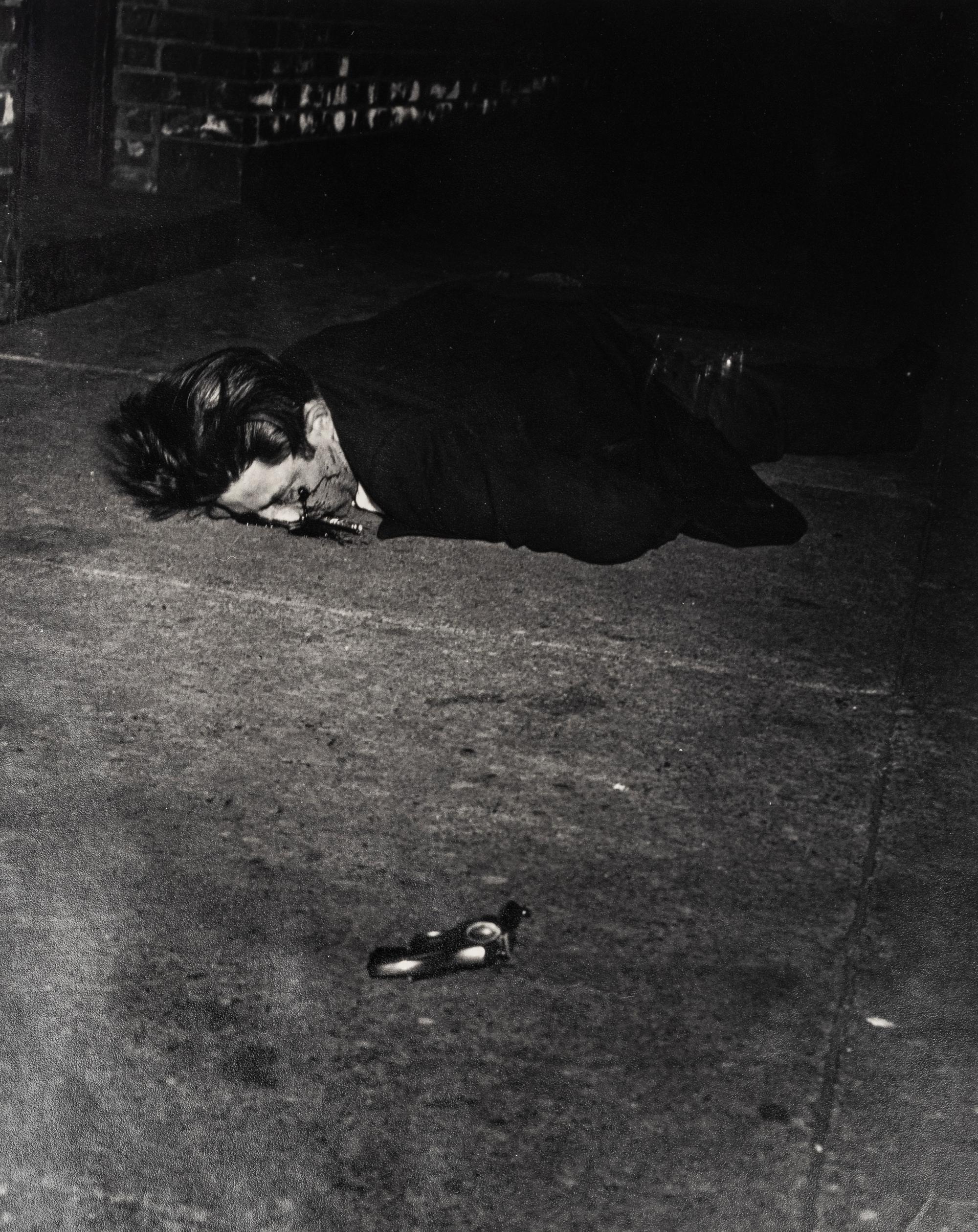 Weegee (1899-1968) Gunman killed by an off-duty cop, 344 Broome Street, February 3, 1942