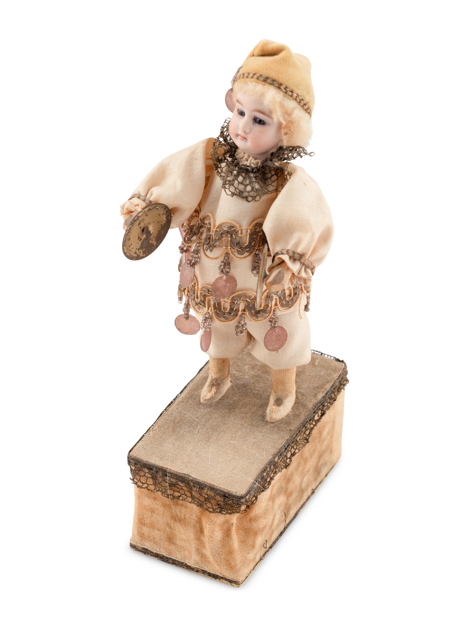 A Group of Squeezer Dolls and Other Toys