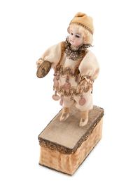 A Group of Squeezer Dolls and Other Toys