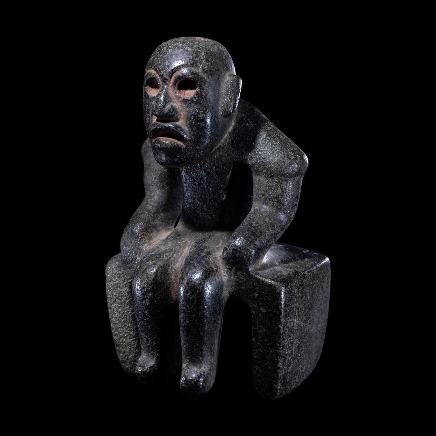 An Olmec Serpentine Seated Figure