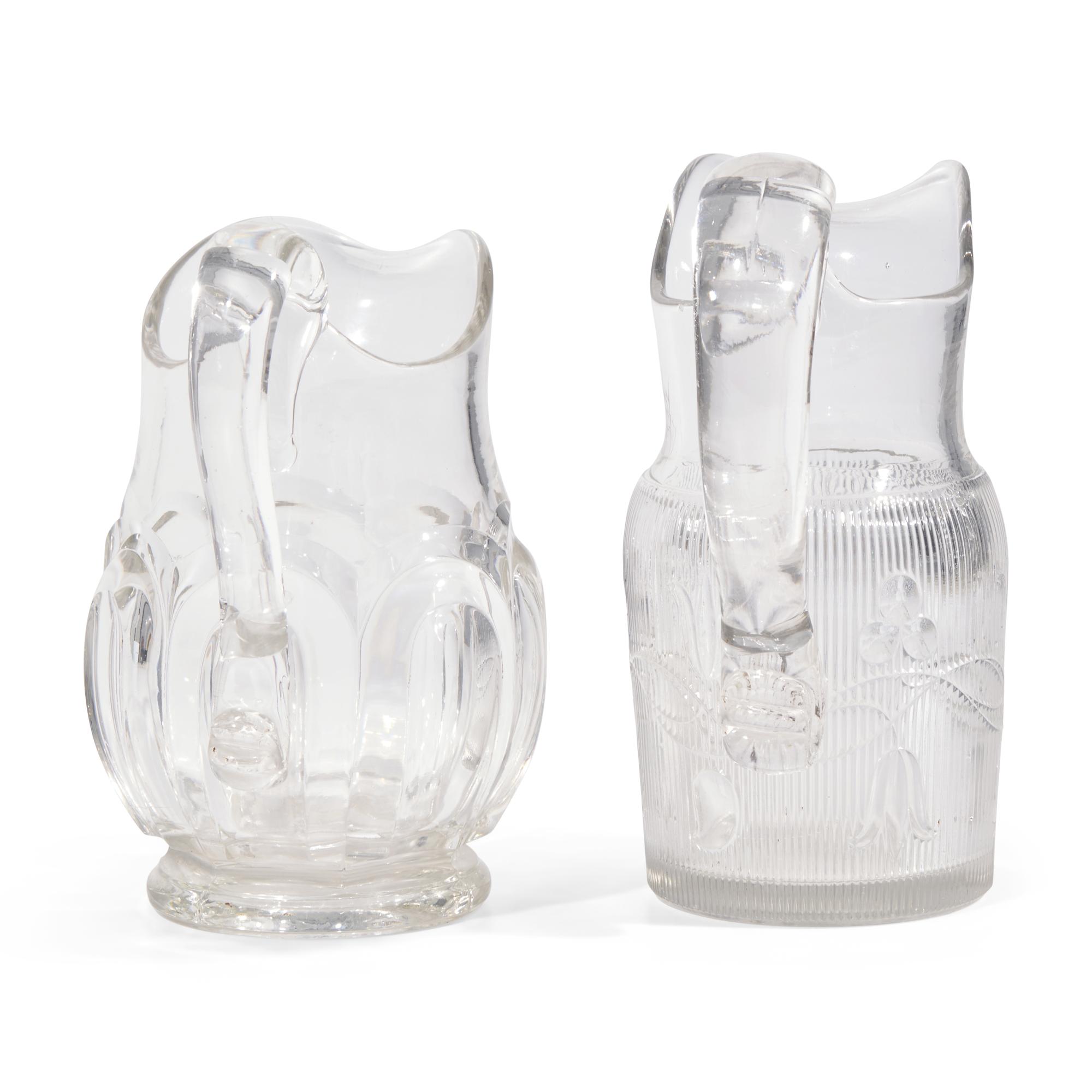 Two Pressed and Molded Flint Glass Pitchers