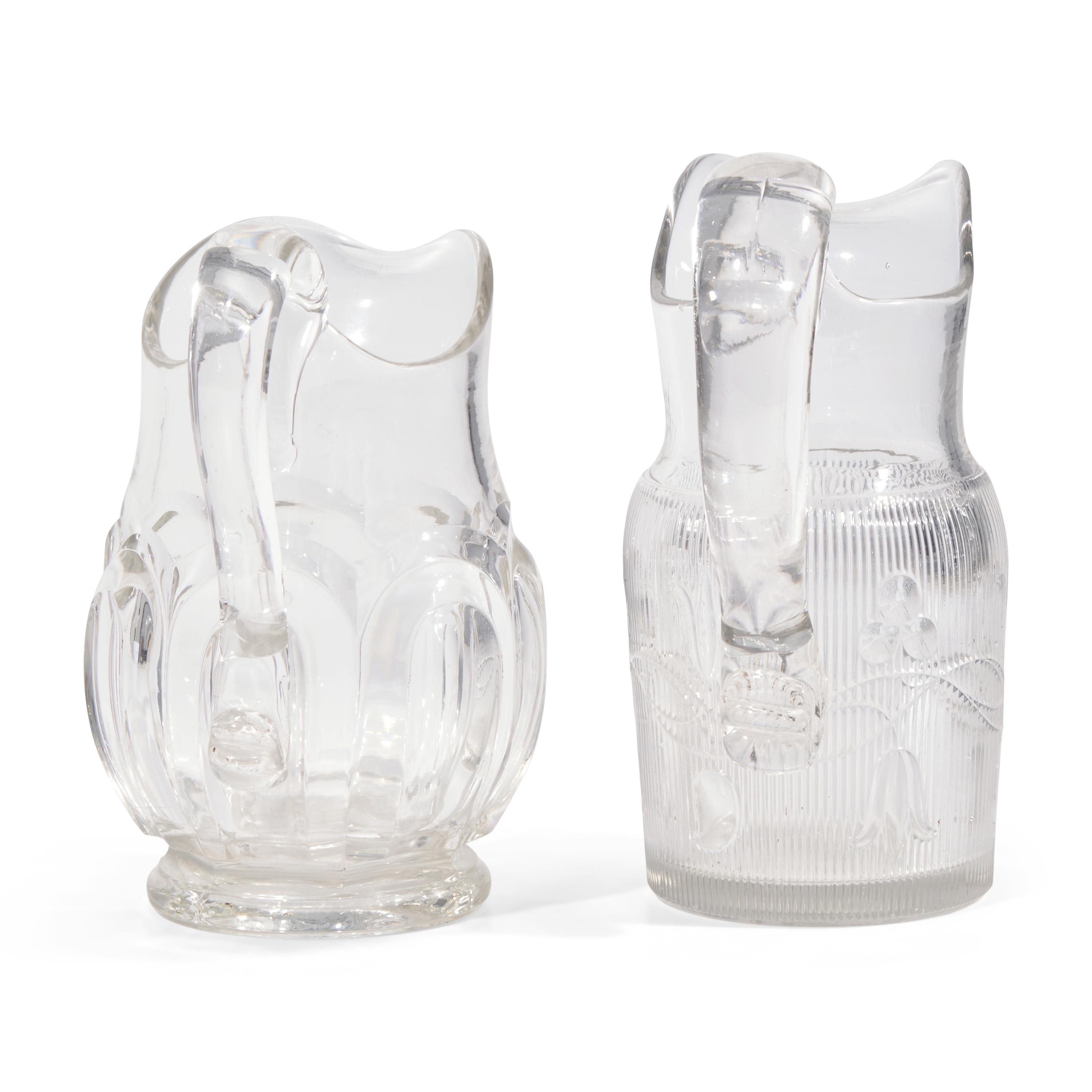 Two Pressed and Molded Flint Glass Pitchers