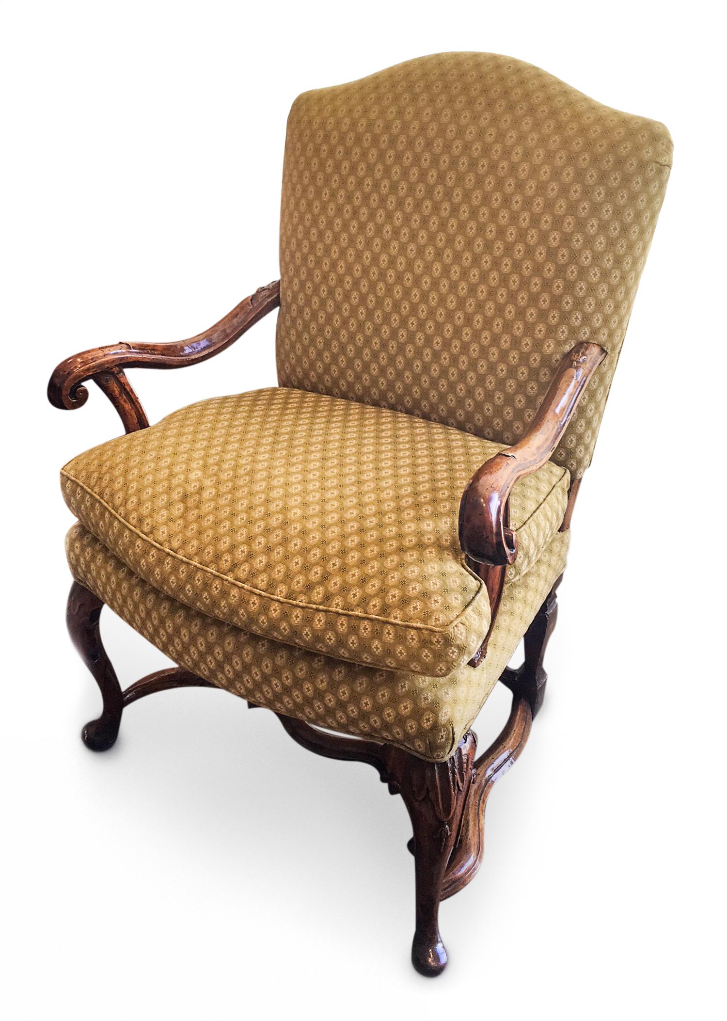 A Continental Carved Walnut Open Armchair Height 41 inches. — 19TH CENTURY
