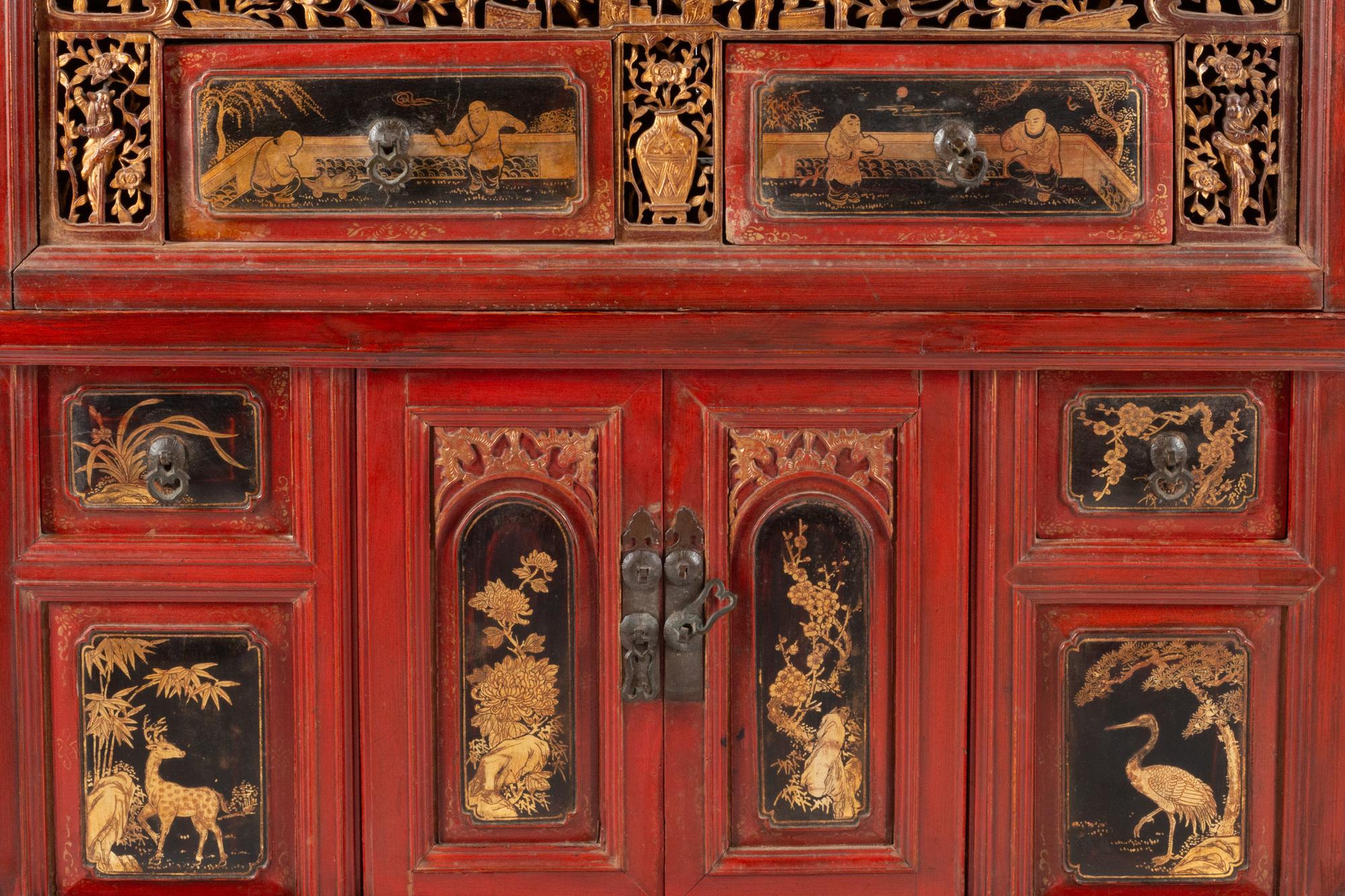 A Chinese Red Lacquer and Parcel Gilt Two-Part Cabinet