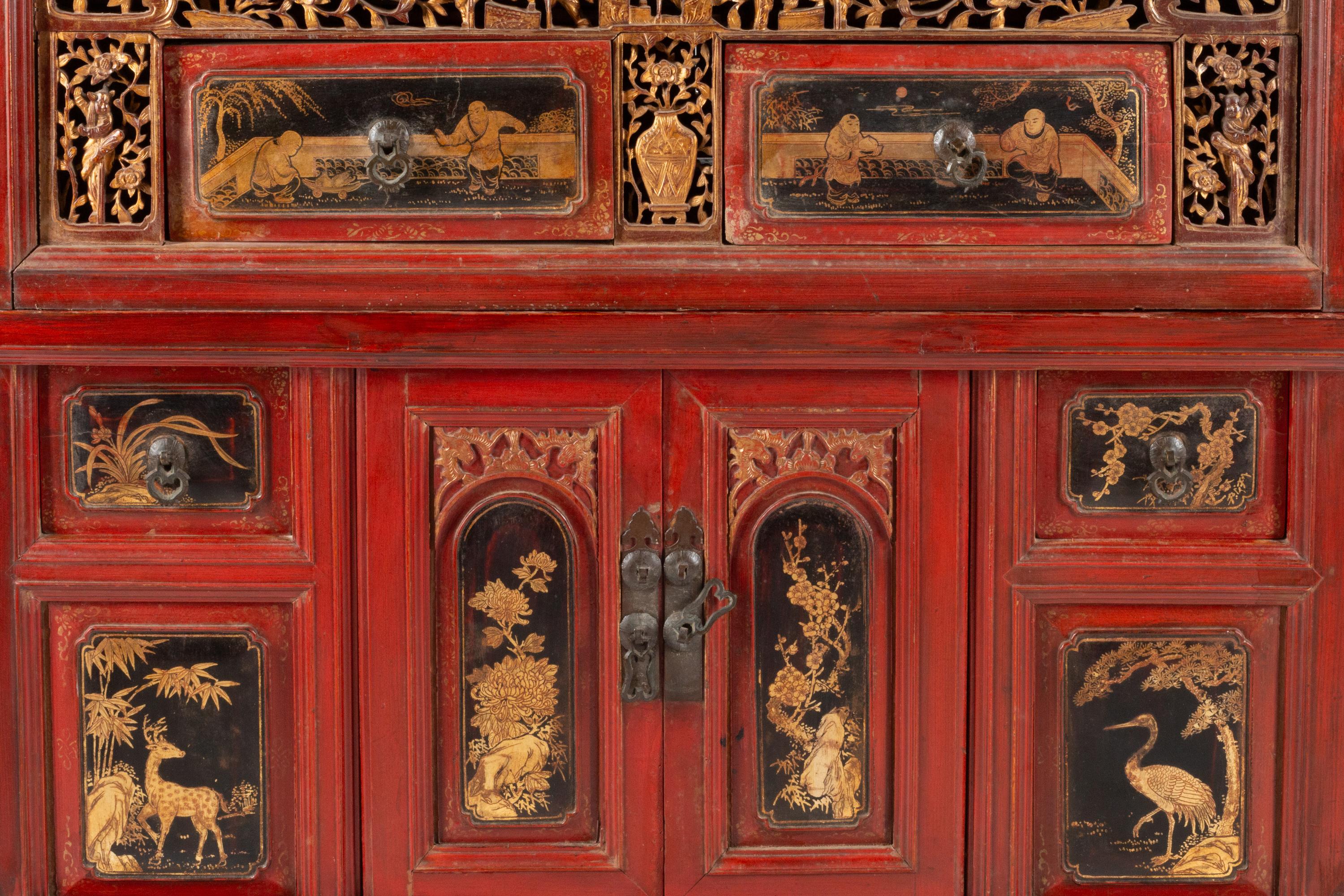 A Chinese Red Lacquer and Parcel Gilt Two-Part Cabinet