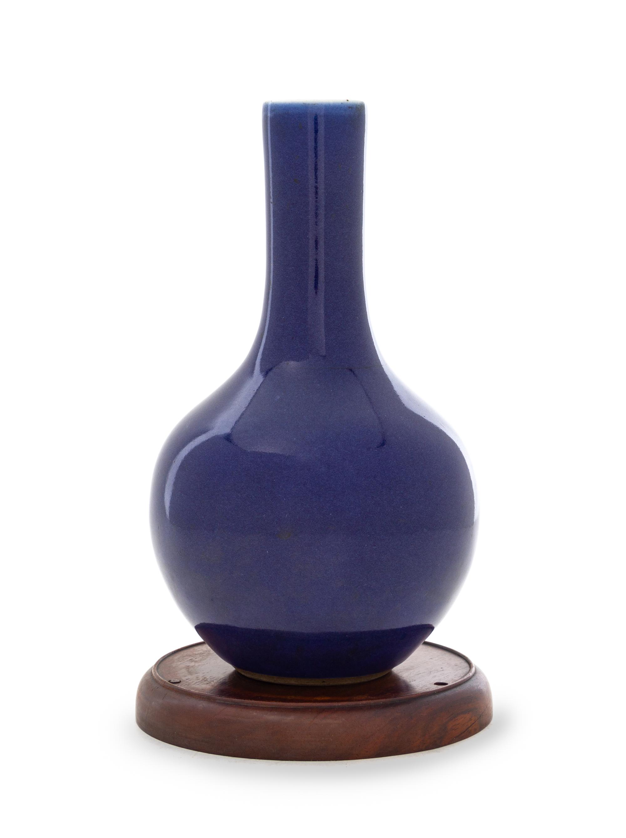 A Chinese Blue Glazed Porcelain Bottle Vase Height 8 1/4 inches. — 18TH CENTURY