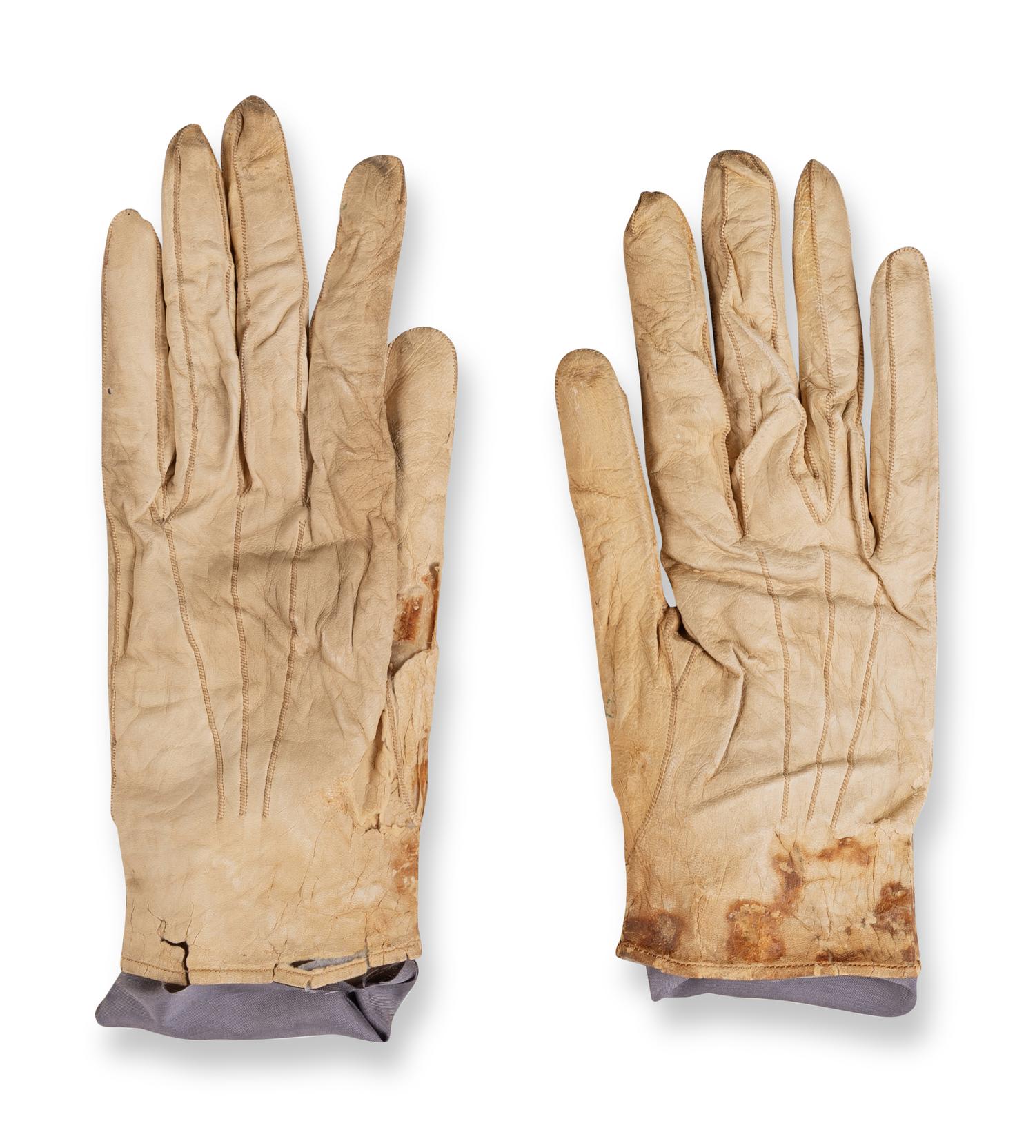 [LINCOLN ASSASSINATION]. A pair of stained leather gloves carried by President Abraham Lincoln at Ford's Theatre on the night of his assassination, 14 April 1865.