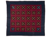 A Red, Orange, Black and Navy Blue Pieced Cotton Quilt