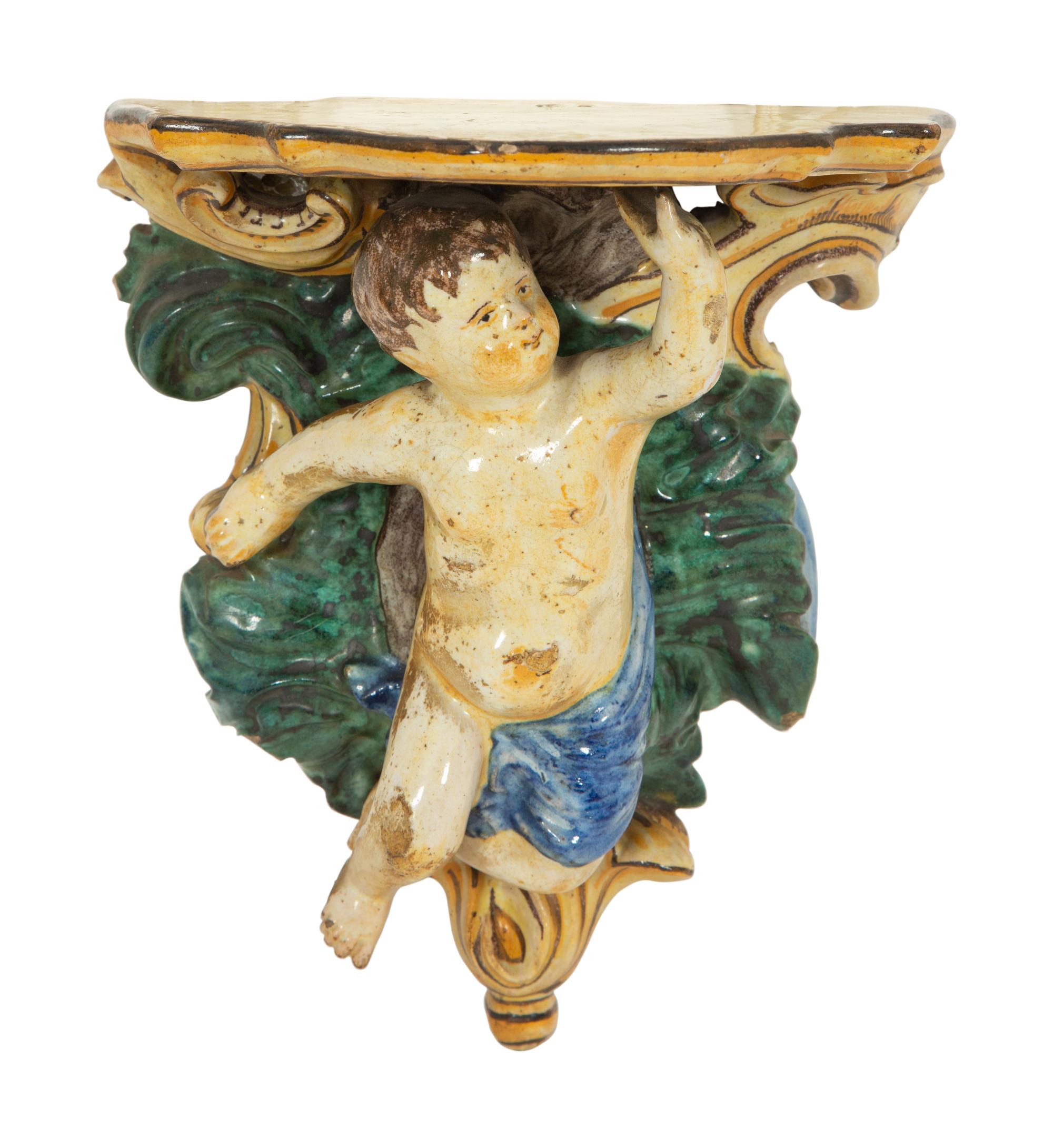 A Pair of Tin-Glazed Earthenware Wall Brackets, and Two Giltwood Wall Brackets