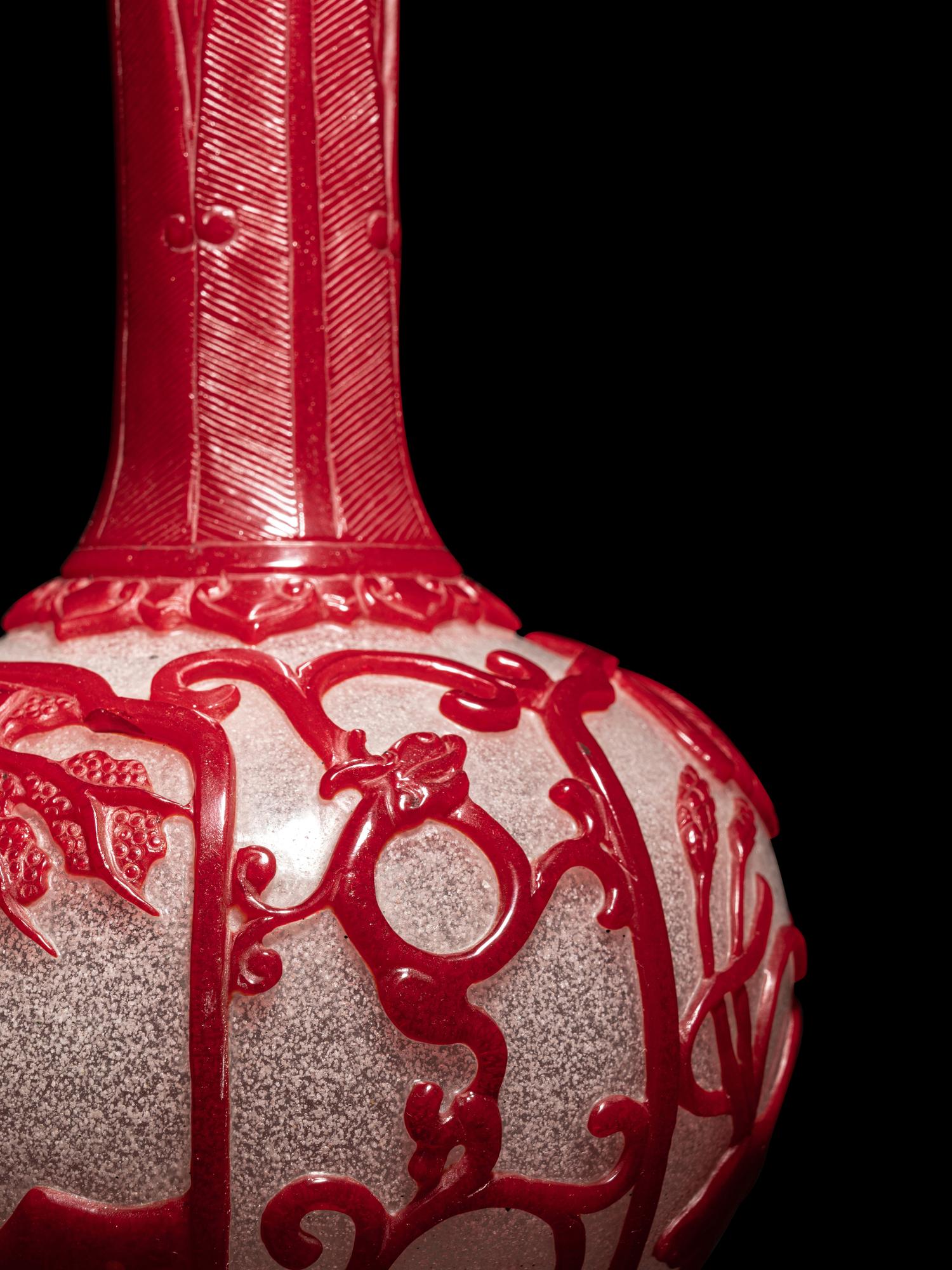 A Chinese Red Overlay Snowflake Ground Peking Glass Bottle Vase