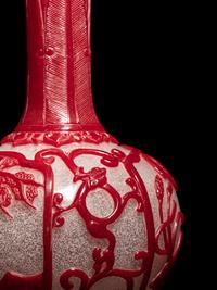 A Chinese Red Overlay Snowflake Ground Peking Glass Bottle Vase