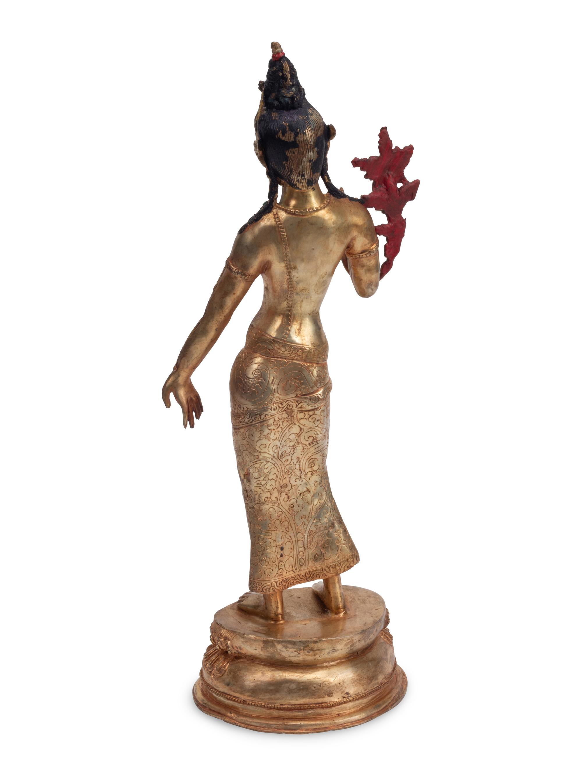 A Gilt Bronze and Rock Crystal Standing Deity
