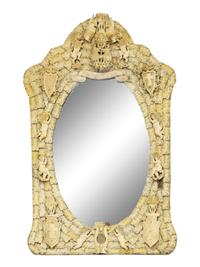 A Continental Carved Bone Mirror with Coat of Arms, Putti and Shields