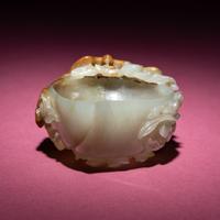A Chinese Russet and Celadon Jade ‘Magpie and Plum Blossoms’ Peach-Form Coupe, 19th Century — 清晚期 青白玉帶皮喜上眉梢桃形杯