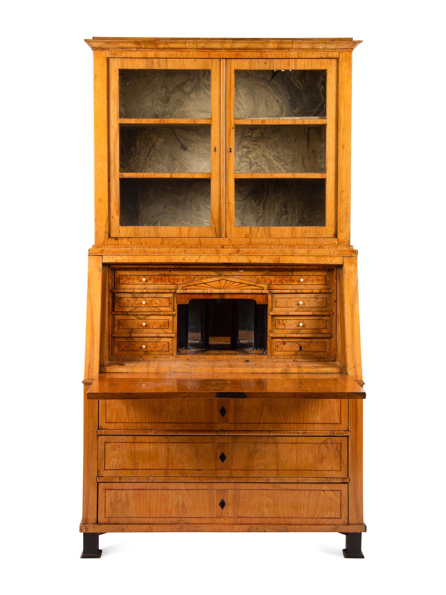 A Biedermeier Figured Walnut Secretary Bookcase