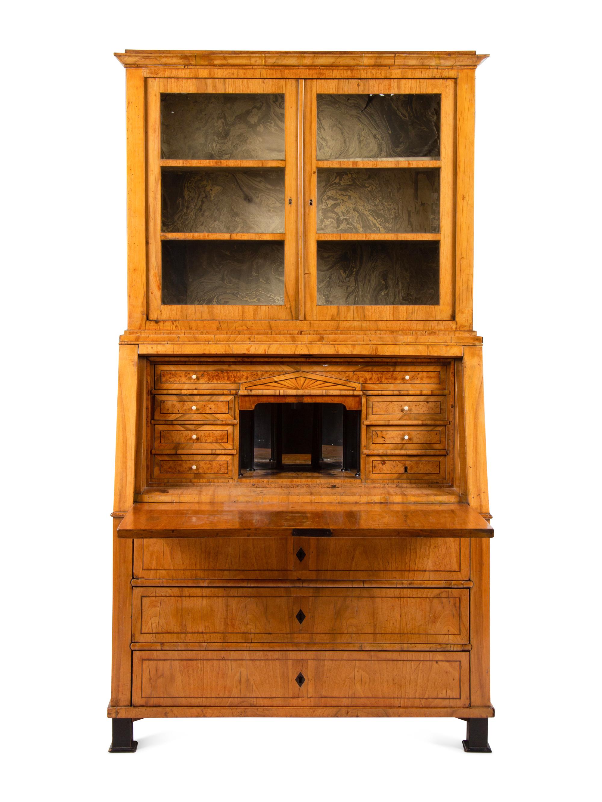 A Biedermeier Figured Walnut Secretary Bookcase
