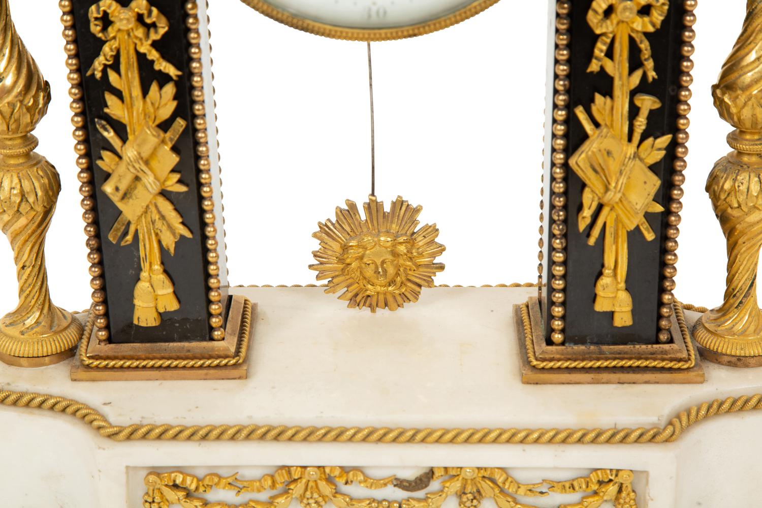 A Louis XVI Gilt Bronze and Marble Mantel Clock