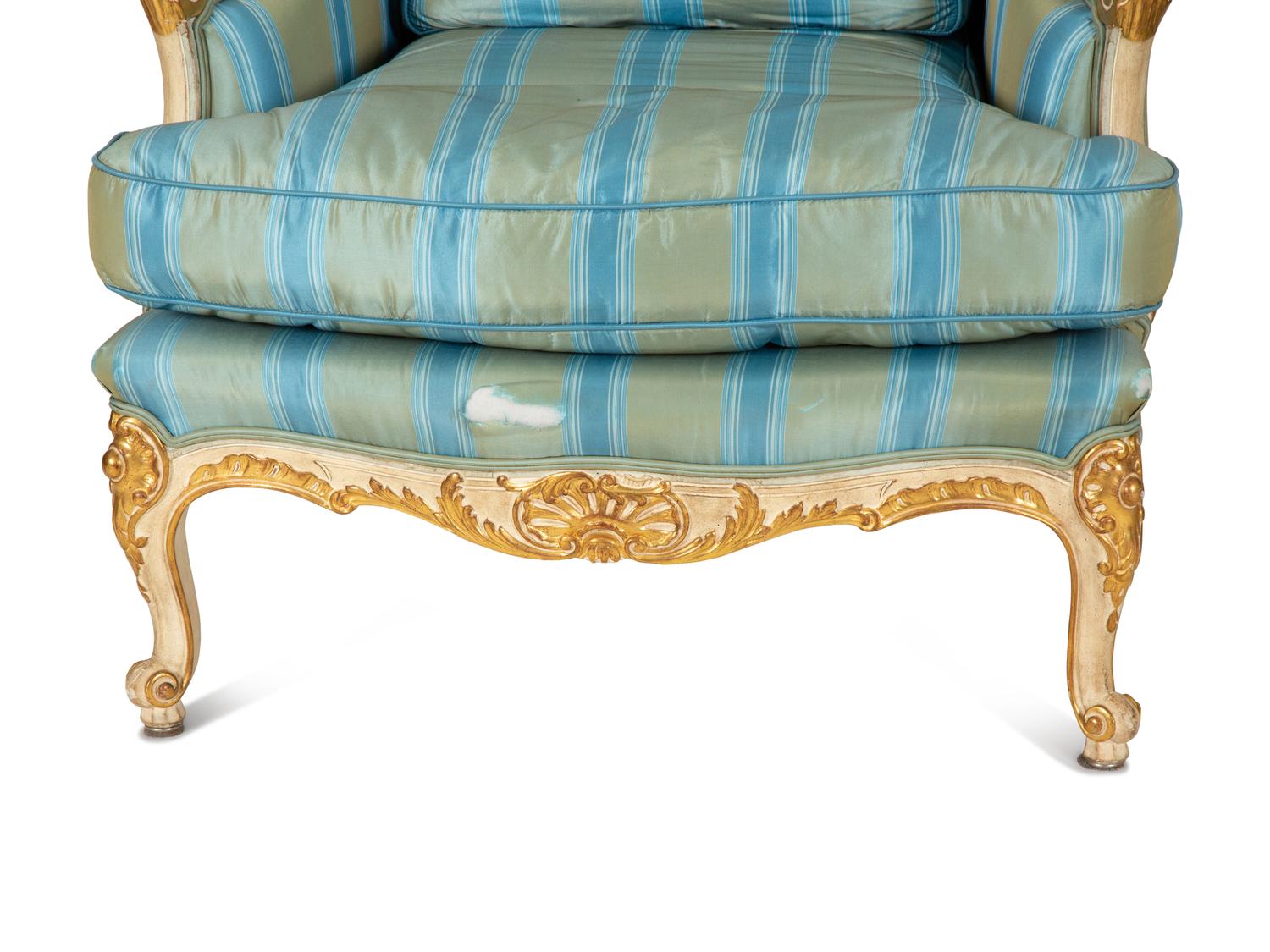 A Pair of Louis XV Style Painted and Parcel Gilt Bergeres