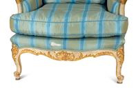 A Pair of Louis XV Style Painted and Parcel Gilt Bergeres
