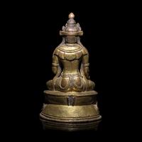 A Tibetan Gilt Copper Alloy Seated Figure of a Crowned Bodhisattva, 16th/17th Century 十六/十七世紀 西藏銅鎏金坐佛