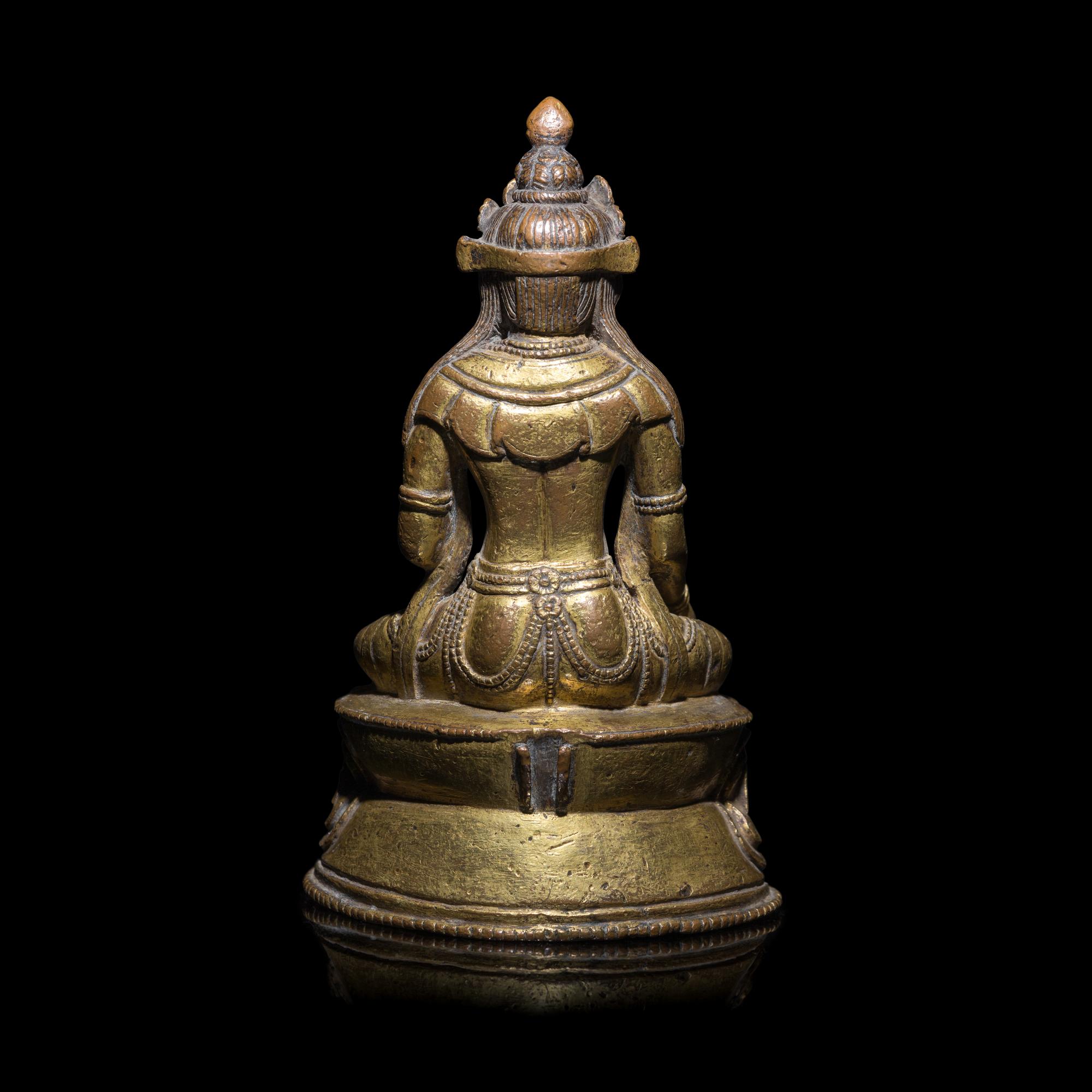 A Tibetan Gilt Copper Alloy Seated Figure of a Crowned Bodhisattva, 16th/17th Century 十六/十七世紀 西藏銅鎏金坐佛