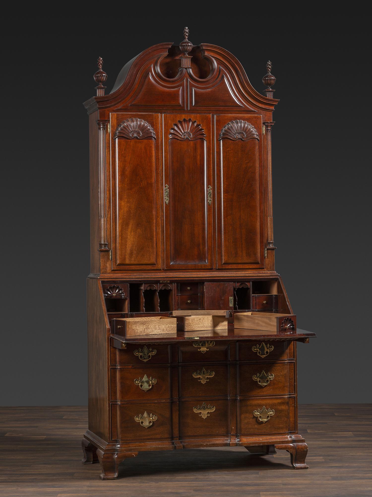 A Kindel Chippendale Revival Shell-and-Block Front Desk-and-Bookcase