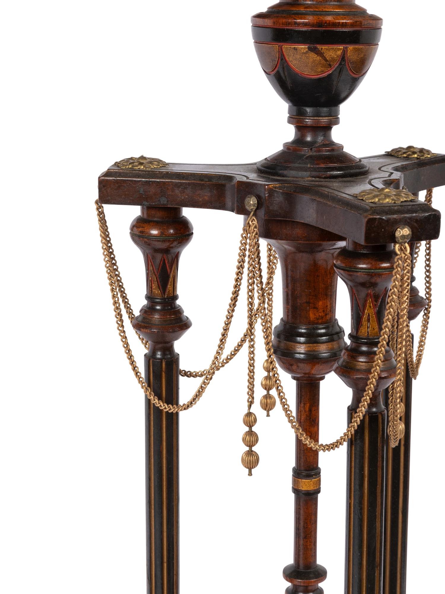 A Pair of Victorian Part-Ebonized and Gilt Walnut Plant Stands