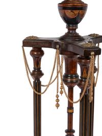 A Pair of Victorian Part-Ebonized and Gilt Walnut Plant Stands