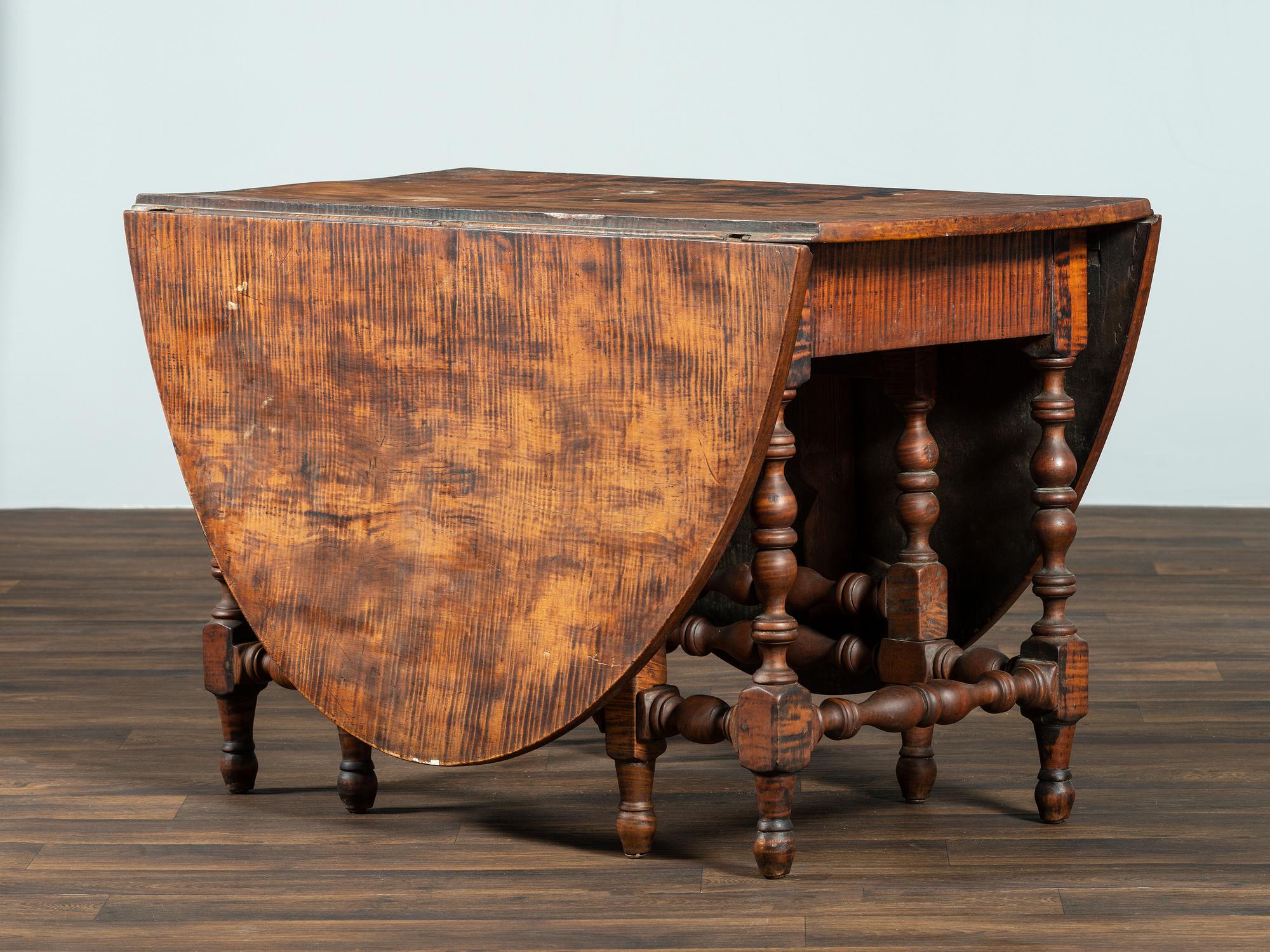 A William and Mary Figured Maple Drop Leaf Dining Table