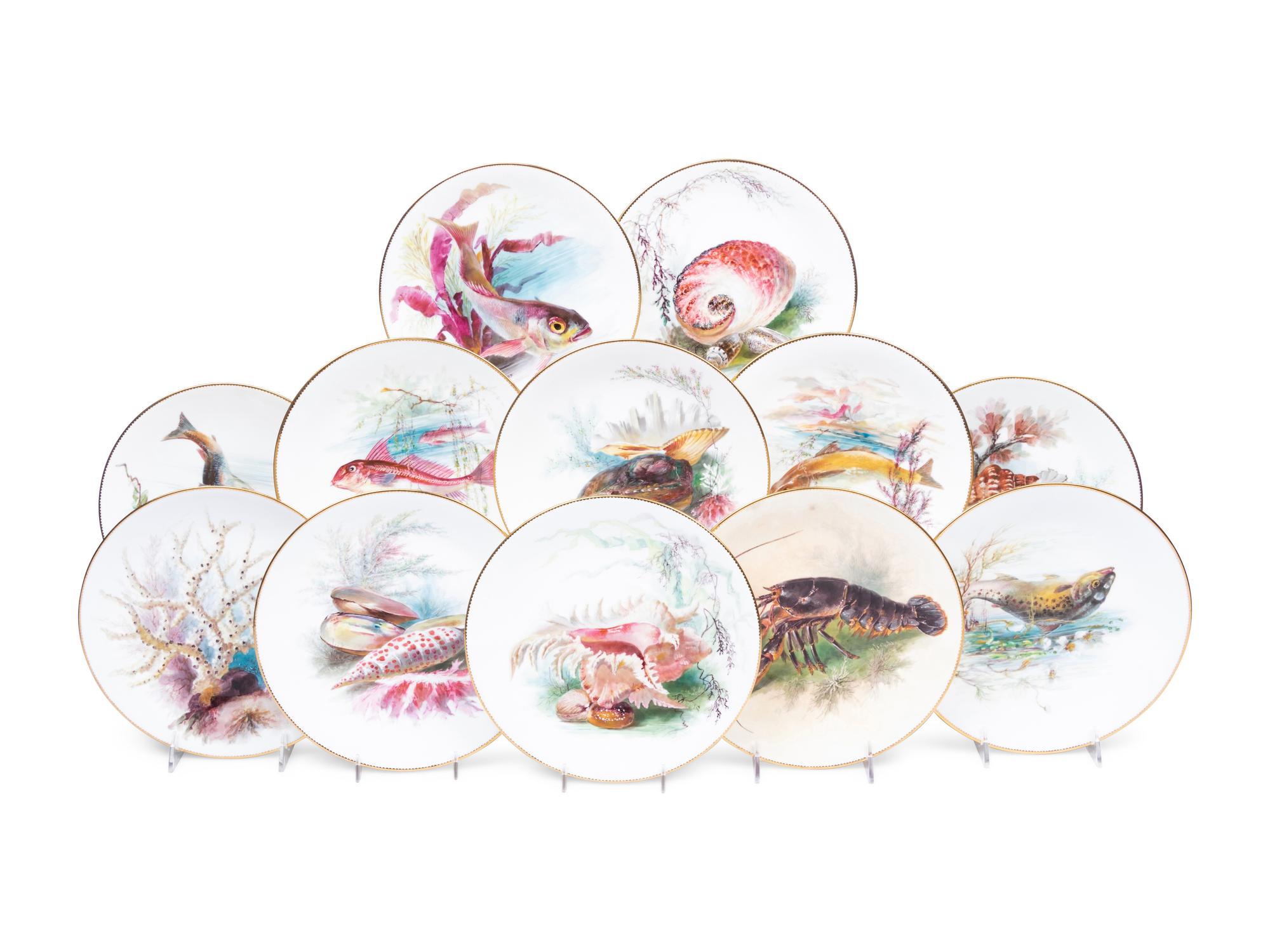 A Set of Twelve Mintons Parcel-Gilt Porcelain Fish and Shell Plates