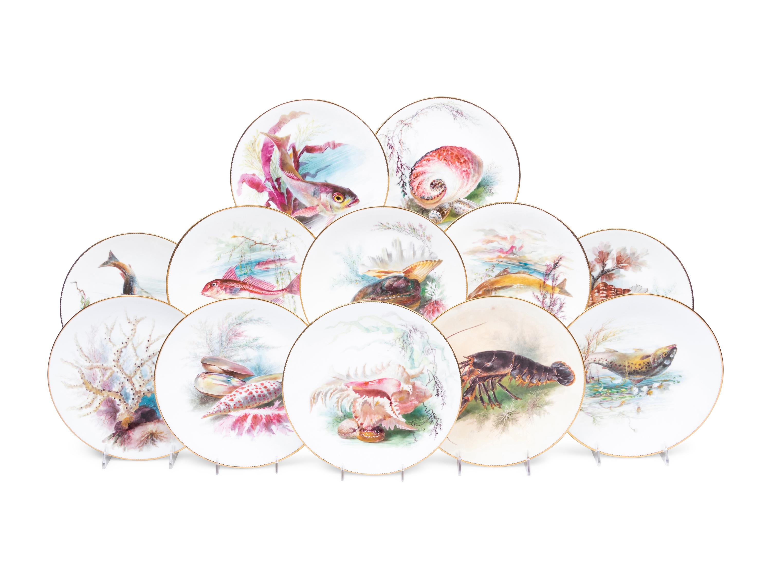 A Set of Twelve Mintons Parcel-Gilt Porcelain Fish and Shell Plates