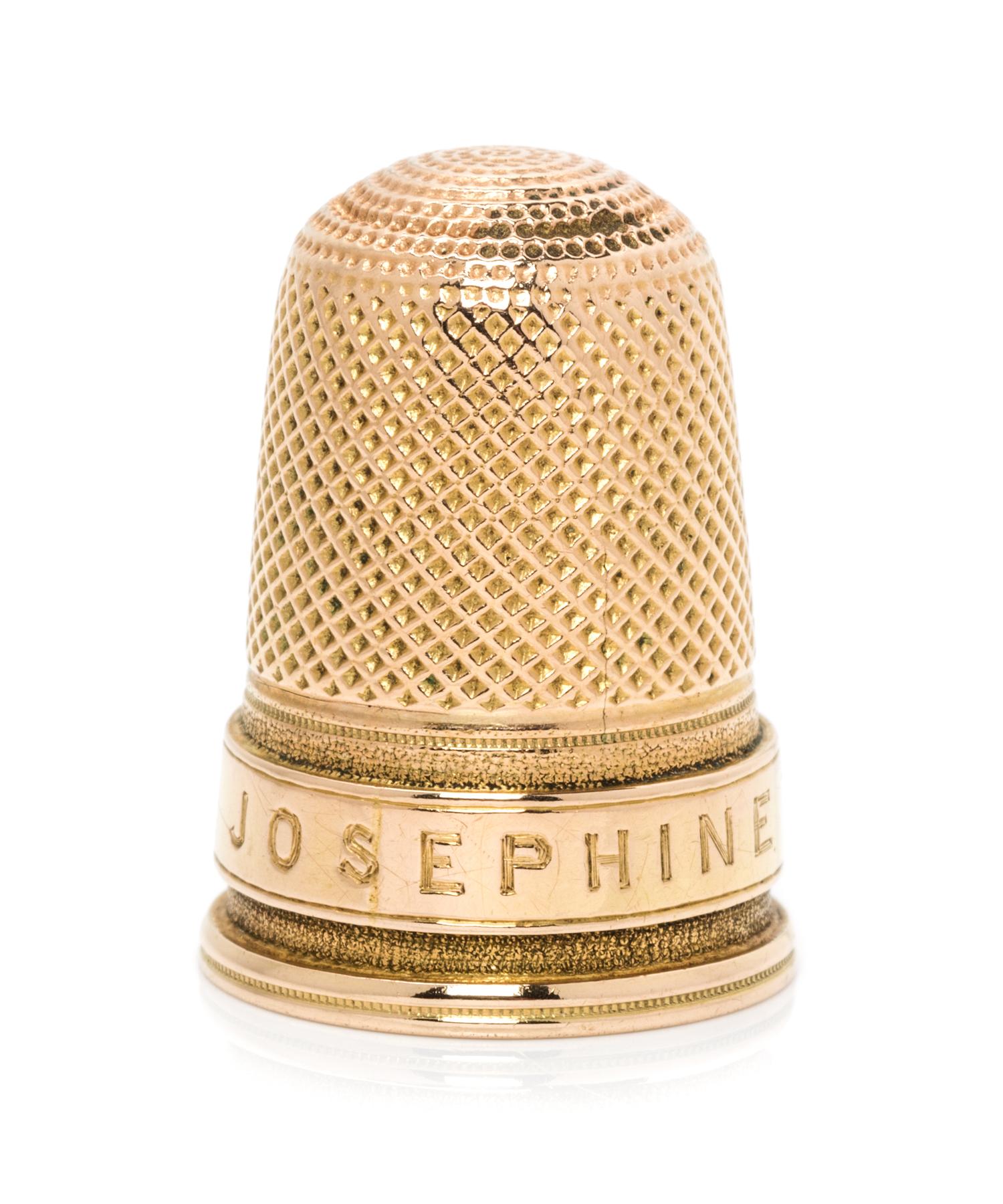 A Continental Yellow Gold Thimble, , the knurled top and diapered body above a band in the form of a belt, engraved Josephine on the st