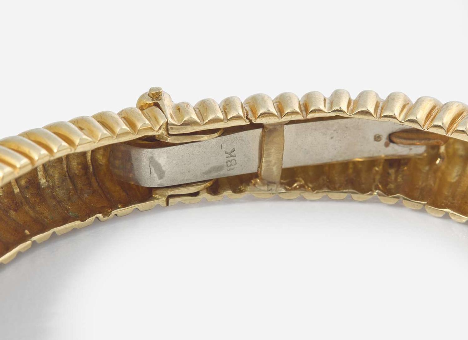 A Pair of Matching 18K Yellow Gold Bangle Bracelets with Diamonds