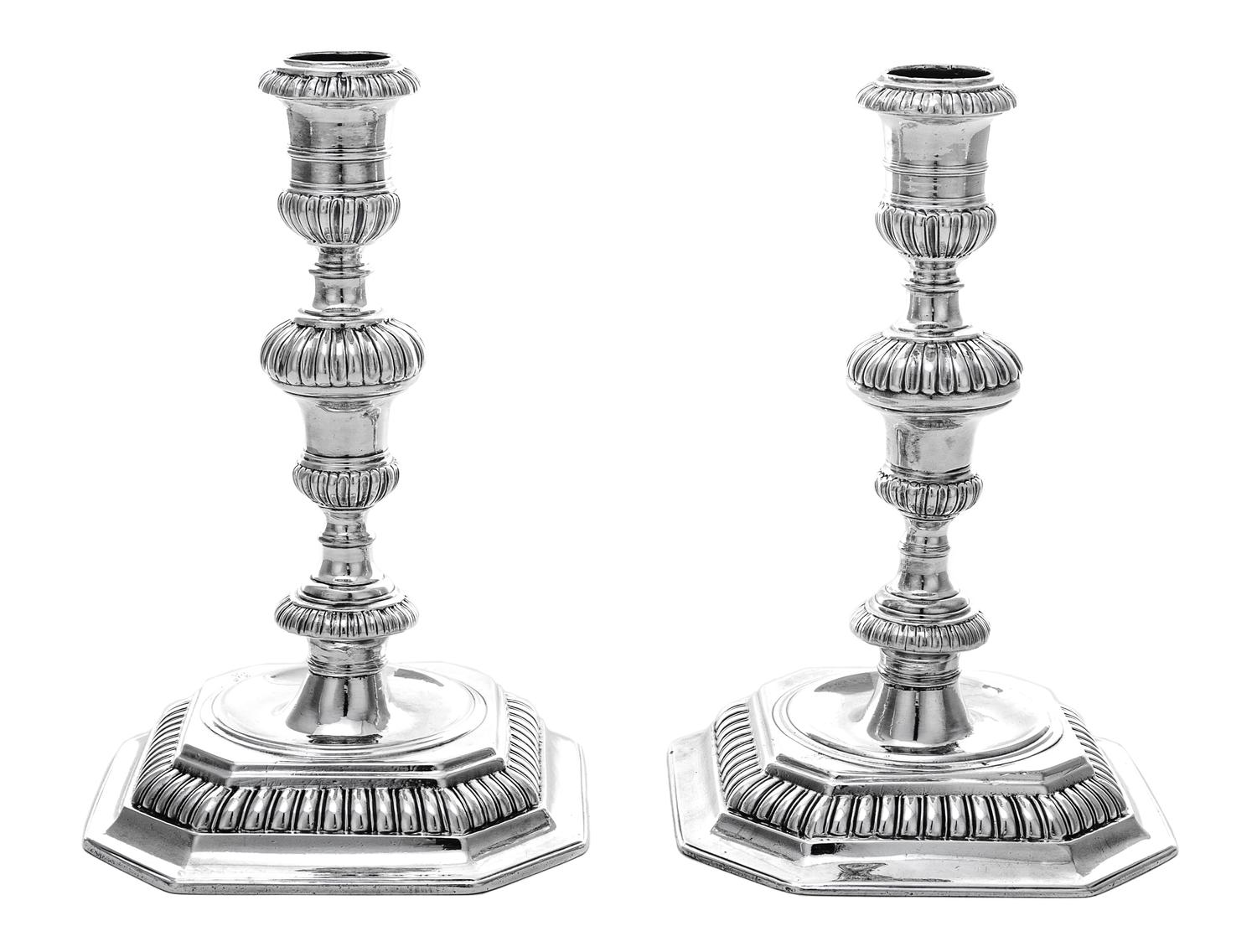 A Pair of William III Silver Candlesticks, John Laughton, London, 1701, each having a baluster stem gadroon banded knops, raised on a c