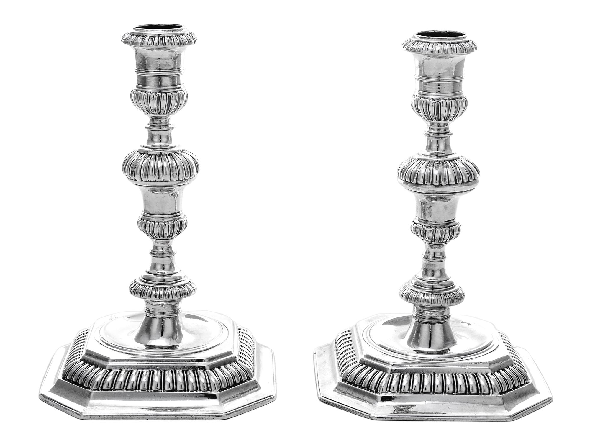 A Pair of William III Silver Candlesticks, John Laughton, London, 1701, each having a baluster stem gadroon banded knops, raised on a c