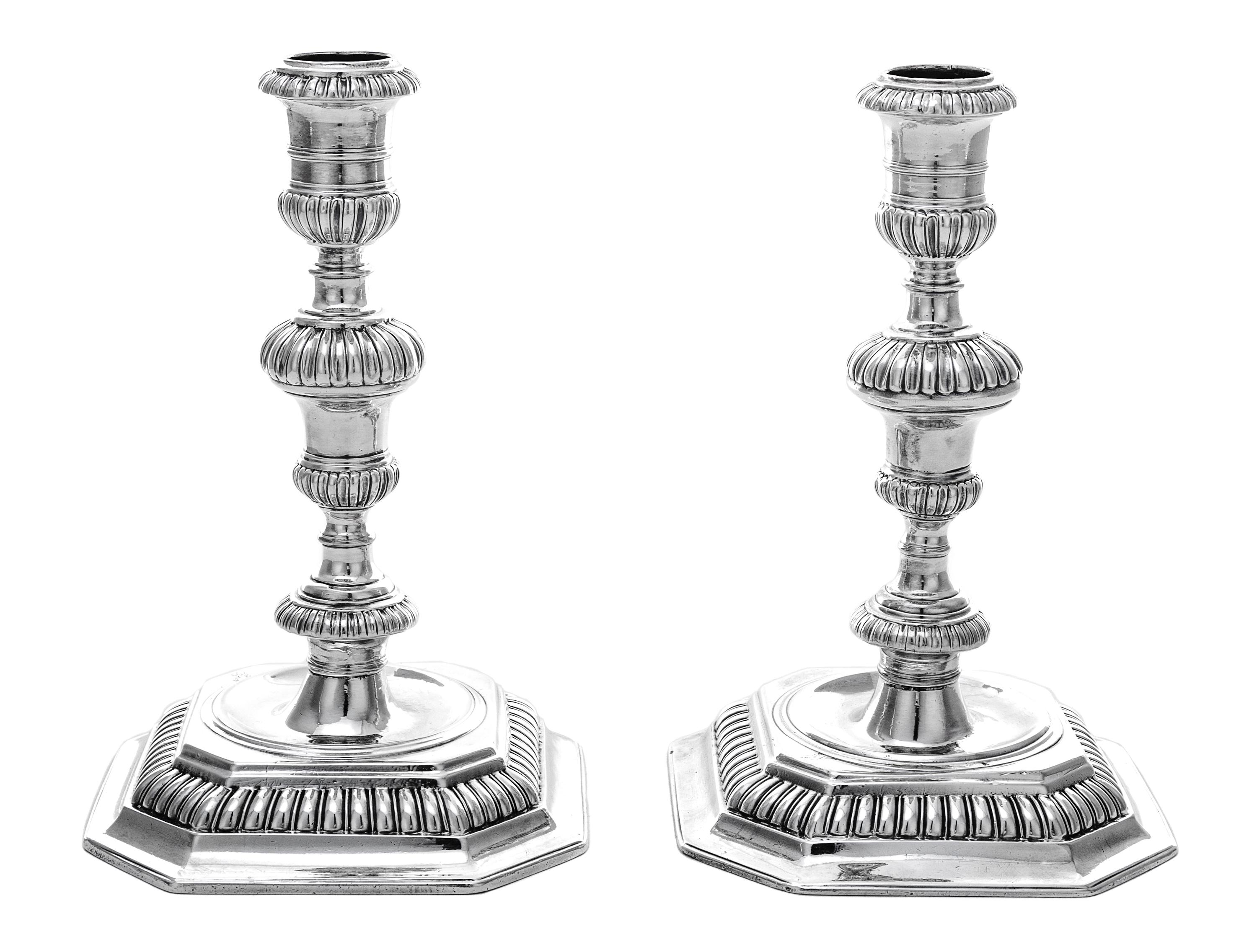 A Pair of William III Silver Candlesticks, John Laughton, London, 1701, each having a baluster stem gadroon banded knops, raised on a c