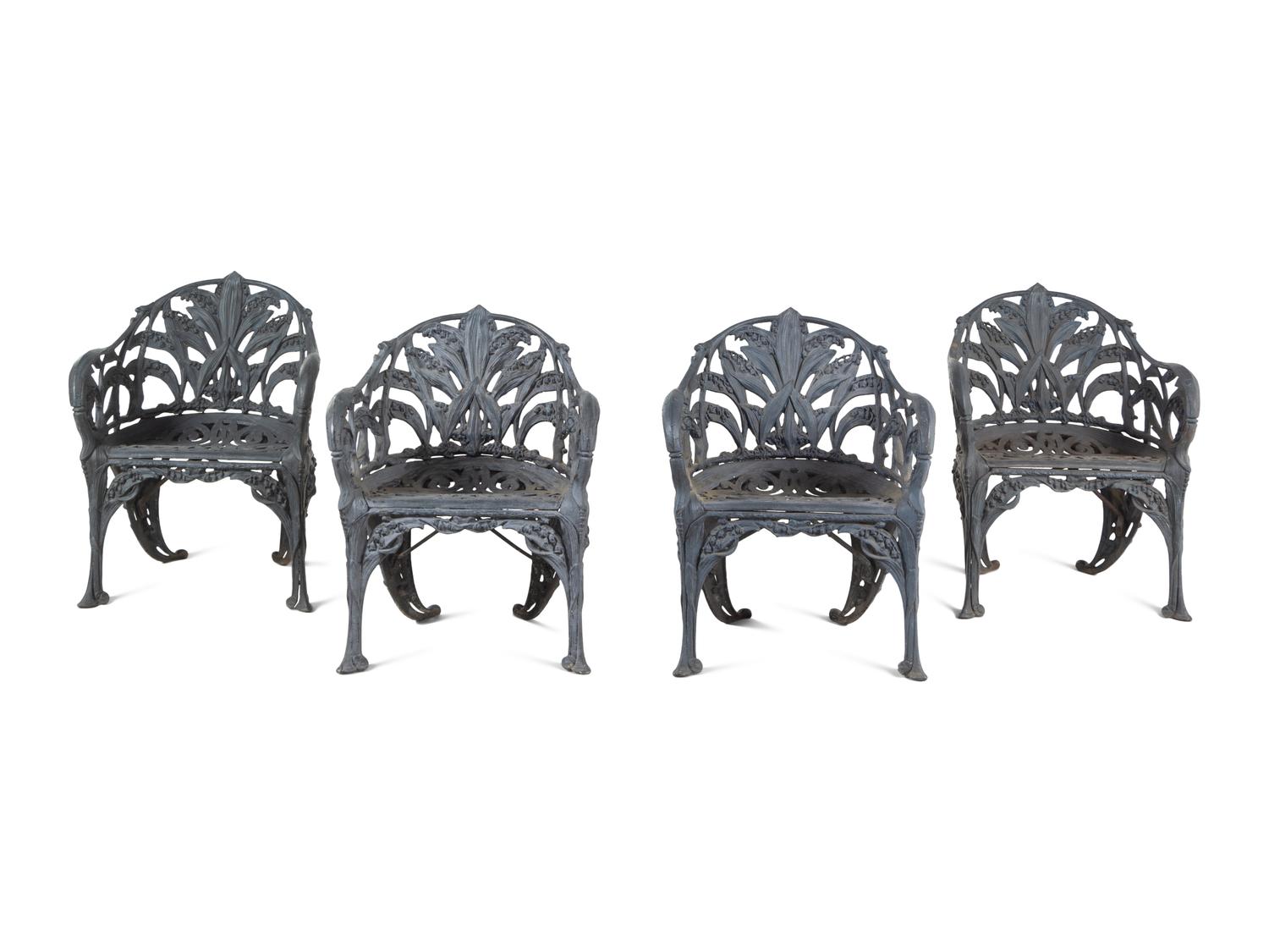 A Set of Four English Cast Iron Garden Chairs