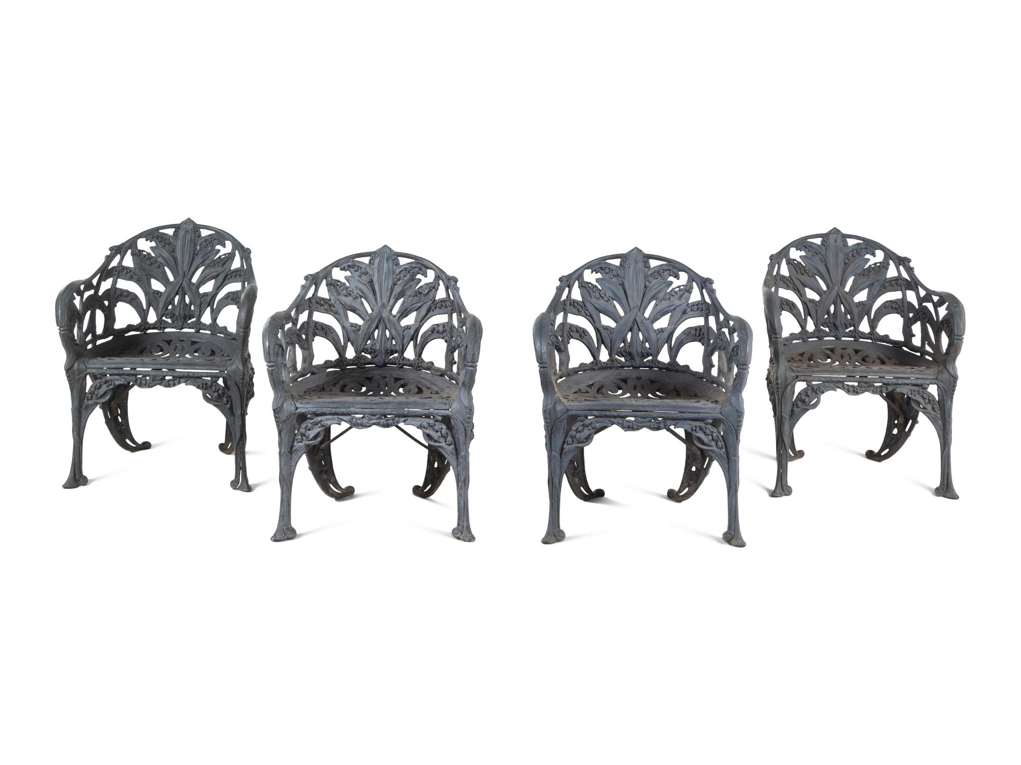 A Set of Four English Cast Iron Garden Chairs