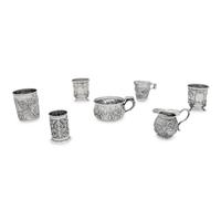 A Collection of Silver Repousse Decorated Table Articles