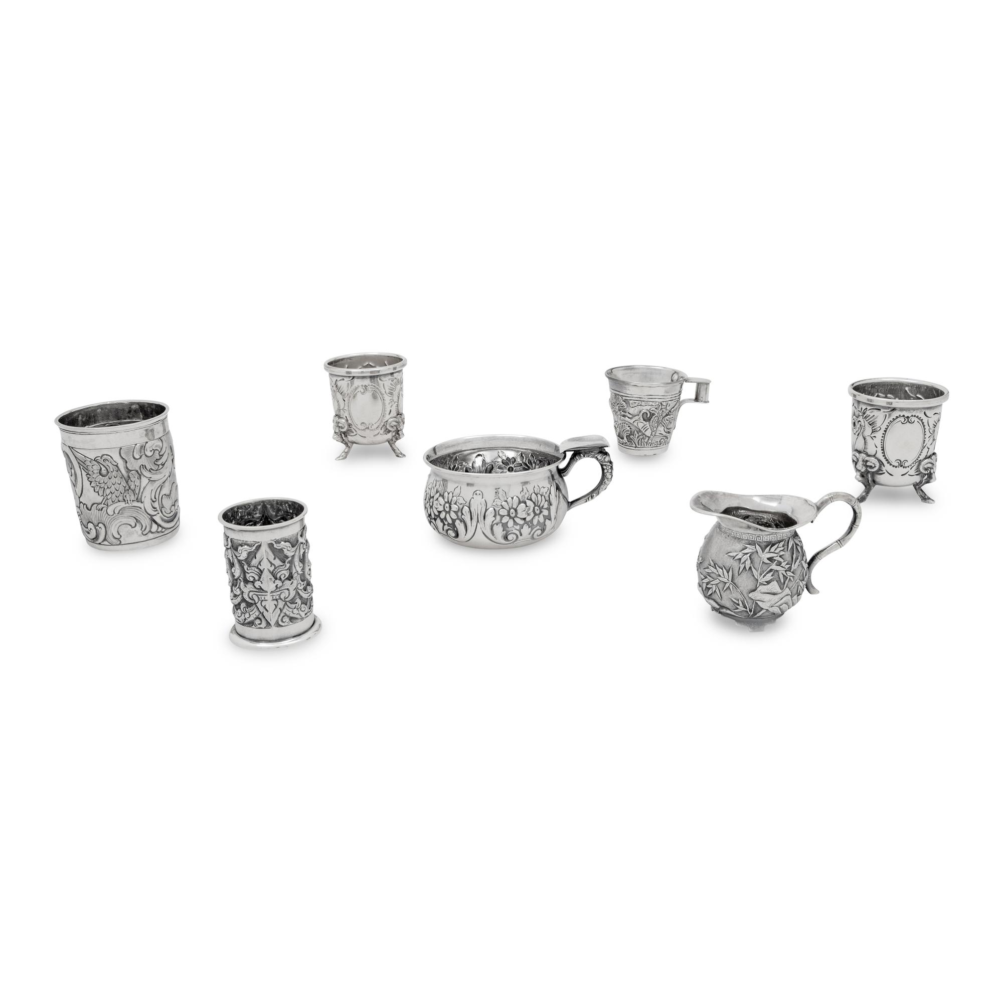 A Collection of Silver Repousse Decorated Table Articles
