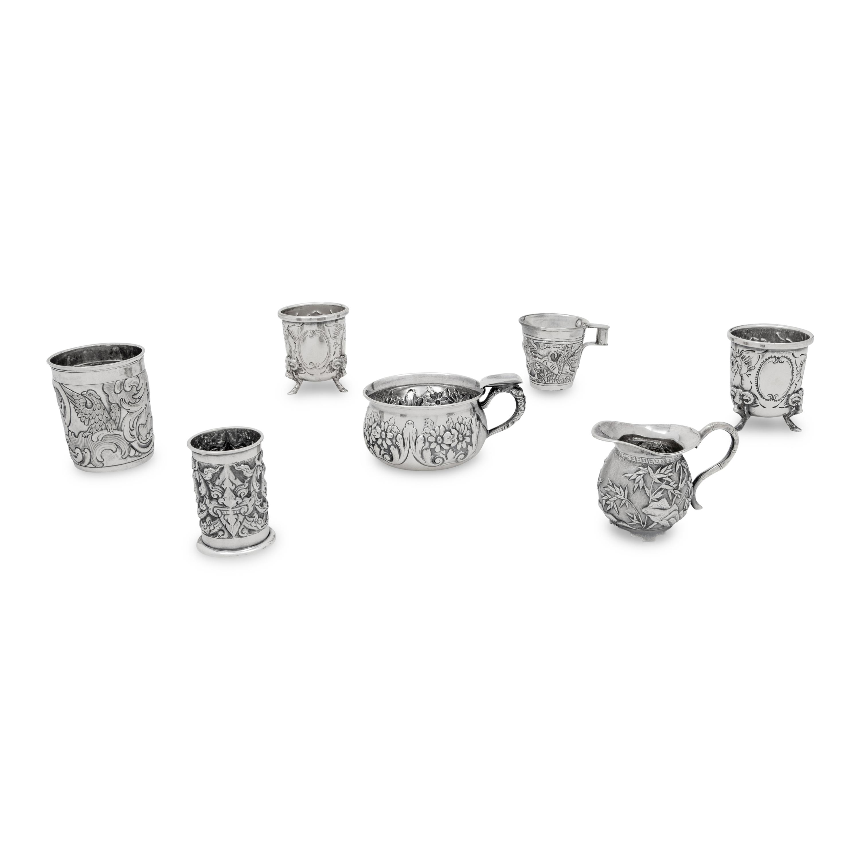 A Collection of Silver Repousse Decorated Table Articles