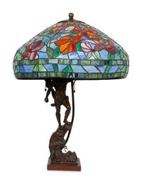 A Bronze Figural Table Lamp with Leaded Glass Shade — SECOND HALF 20TH CENTURY