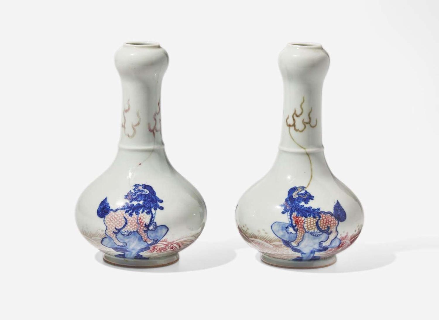 A pair of Chinese underglaze blue and red garlic-head cabinet vases, Kangxi marks 青花釉裡紅蒜頭瓶一對 康熙款