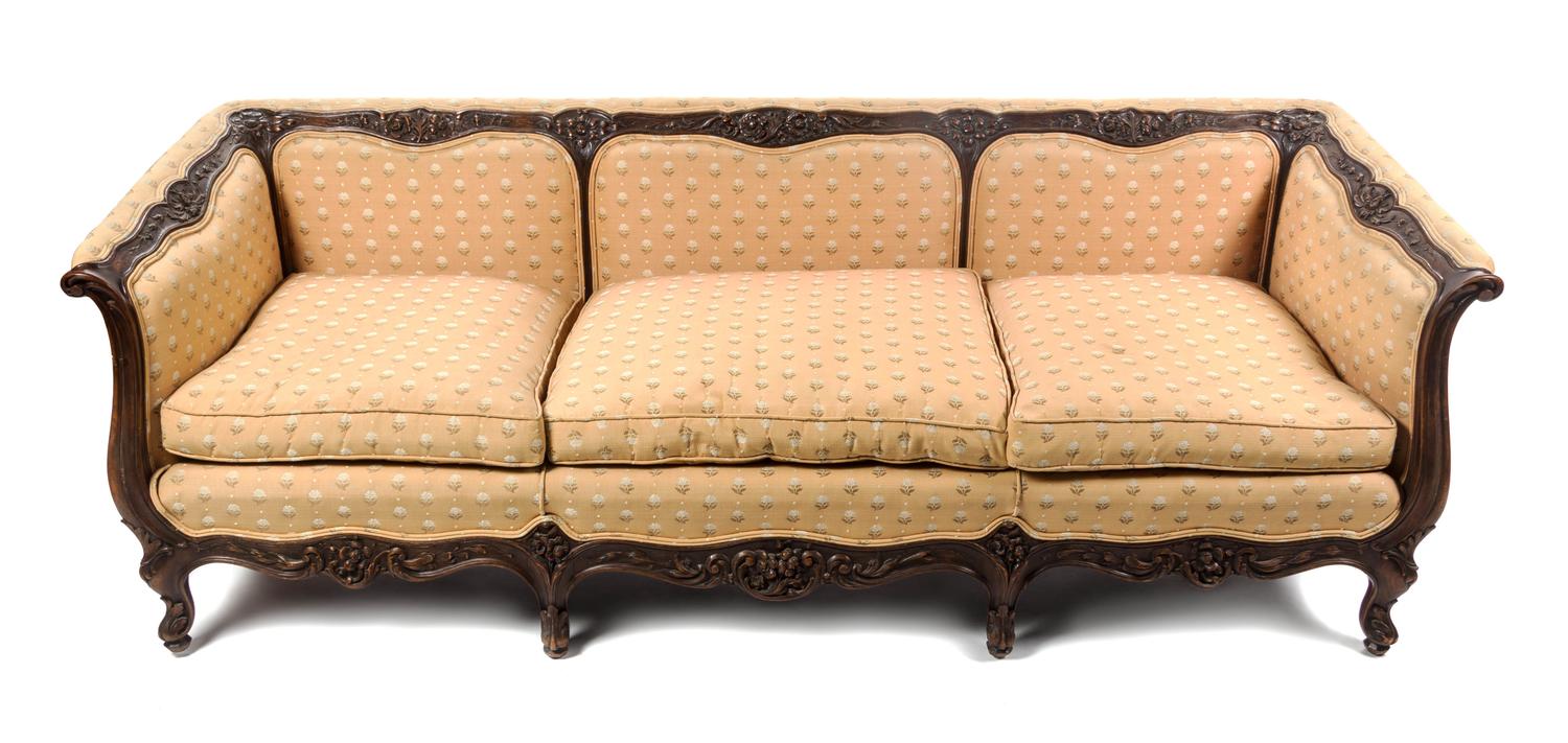 A Louis XV Style Carved Walnut Canape, Width 86 1/2 inches.